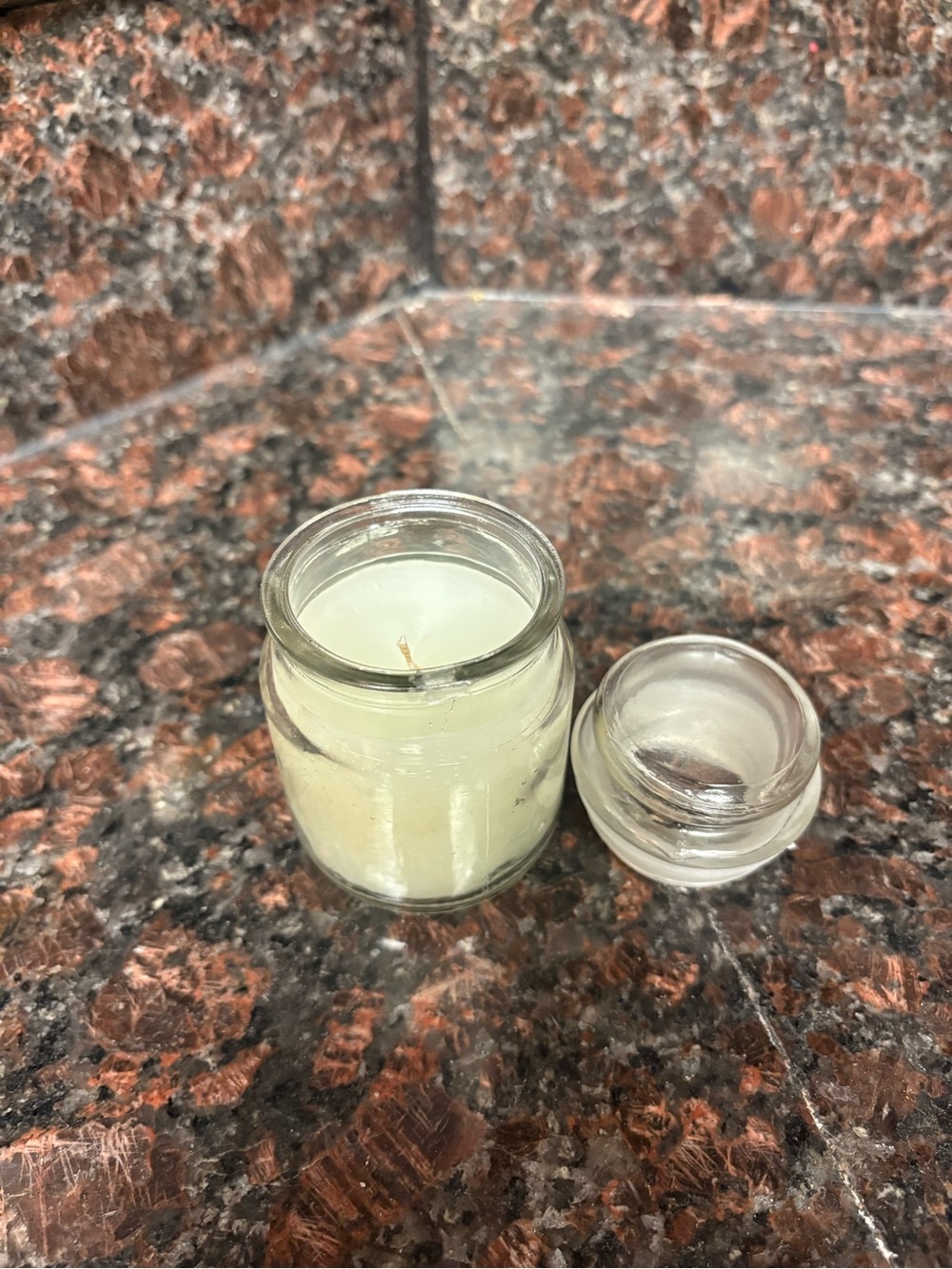 Handmade by me upcycled candle is a small glass jar with a lid, scent is vanilla
